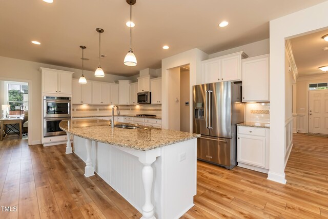 3536 Greenville Loop Rd, Wake Forest, NC 27587 - kitchen featuring appliances with stainless steel finishes, a sink, decorative backsplash, white cabinetry, and recessed lighting