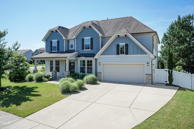 3536 Greenville Loop Rd, Wake Forest, NC 27587 - craftsman-style house featuring a garage, concrete driveway, a shingled roof, and stone siding