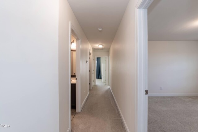 3536 Greenville Loop Rd, Wake Forest, NC 27587 - corridor with light colored carpet and baseboards