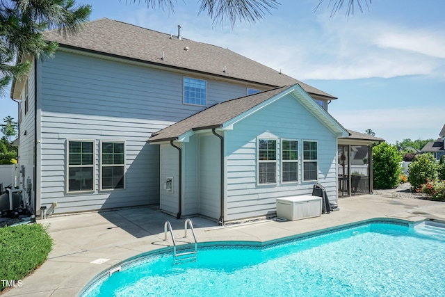 3536 Greenville Loop Rd, Wake Forest, NC 27587 - rear view of house featuring a patio, an outdoor pool, a sunroom, and roof with shingles