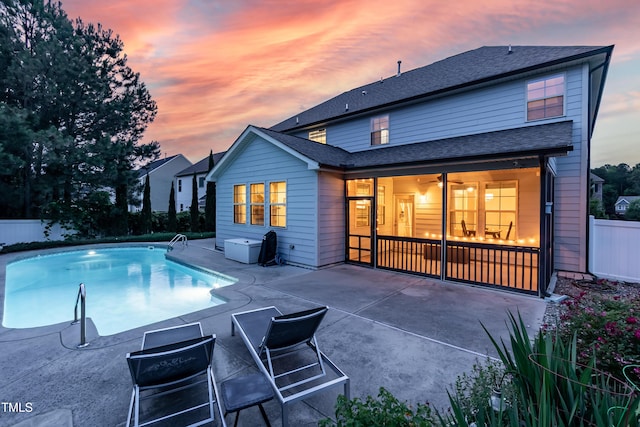 3536 Greenville Loop Rd, Wake Forest, NC 27587 - back of property at dusk featuring a patio area and a shingled roof