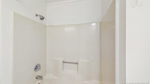 6976 Kings Lynn Loop, Fayetteville, NC 28304 - full bathroom with shower / tub combination and ornamental molding
