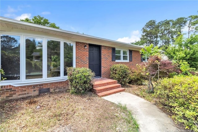 view of front of house with brick siding