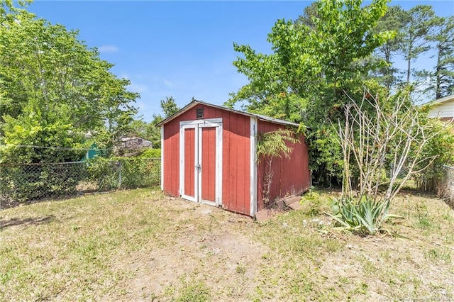 view of shed with a fenced backyard