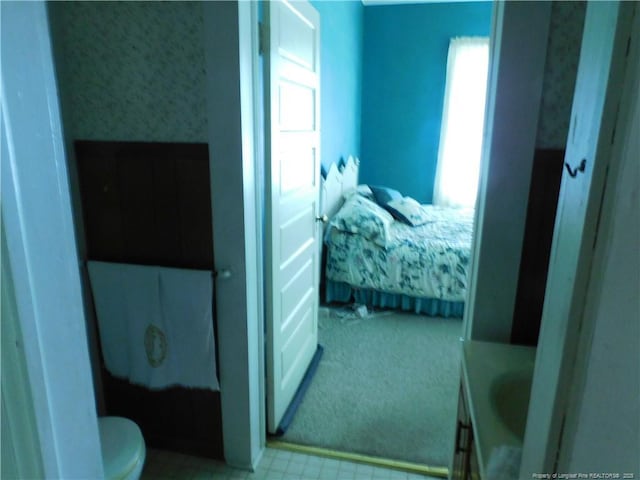 1042 Oquinn Rd, Maxton, NC 28364 - bedroom with wallpapered walls, carpet flooring, and tile patterned floors