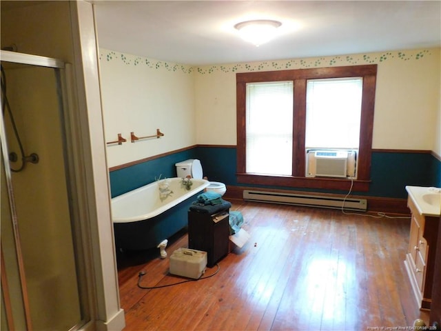 1042 Oquinn Rd, Maxton, NC 28364 - full bath with baseboard heating, vanity, a stall shower, and a freestanding bath