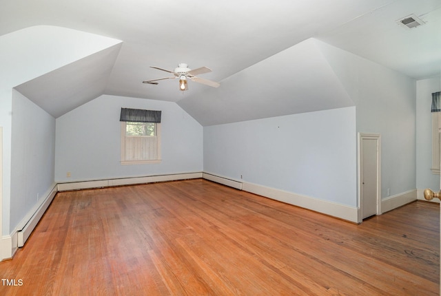 103 E Meadowbrook Dr, Smithfield, NC 27577 - additional living space with a ceiling fan, wood finished floors, baseboard heating, vaulted ceiling, and baseboards