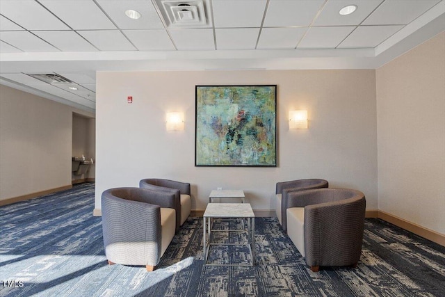 common area featuring a drop ceiling and recessed lighting