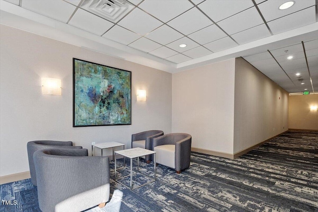 common area with a drop ceiling and recessed lighting