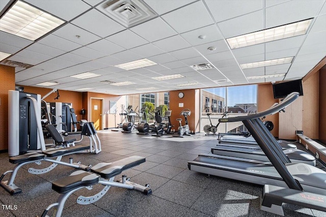 exercise room featuring a drop ceiling
