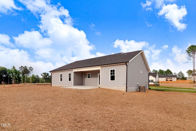 157 Gumtop Dr, Zebulon, NC 27597 - back of house featuring a patio area, cooling unit, and a shingled roof