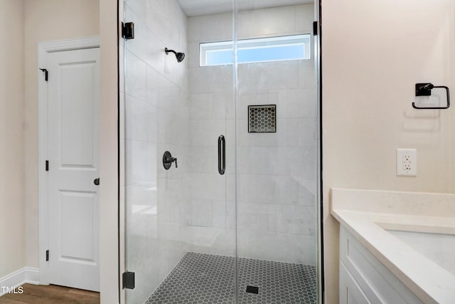 157 Gumtop Dr, Zebulon, NC 27597 - bathroom featuring a shower stall, vanity, and wood finished floors