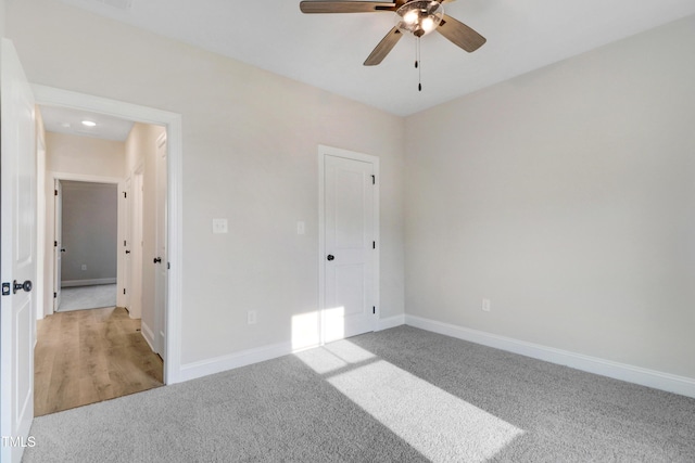 157 Gumtop Dr, Zebulon, NC 27597 - unfurnished bedroom featuring light colored carpet, baseboards, and ceiling fan