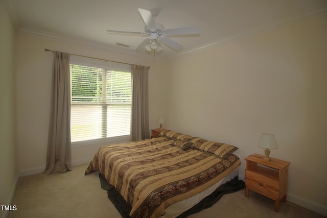 bedroom featuring ornamental molding, light colored carpet, baseboards, and ceiling fan