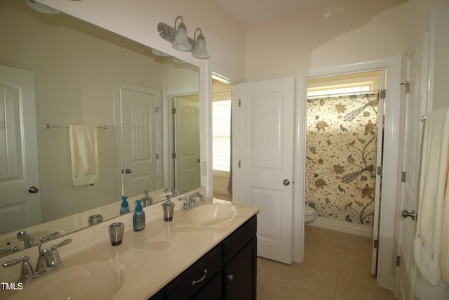 bathroom featuring tile patterned floors, toilet, double vanity, a shower with shower curtain, and baseboards