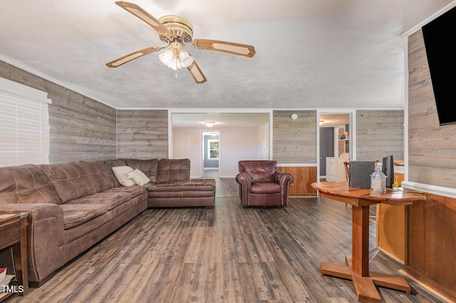 1169 Clayhole Rd, Dunn, NC 28334 - living area with wood walls, ceiling fan, and wood finished floors