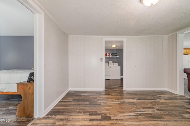 1169 Clayhole Rd, Dunn, NC 28334 - unfurnished living room with washer and clothes dryer, wood finished floors, a textured ceiling, and crown molding