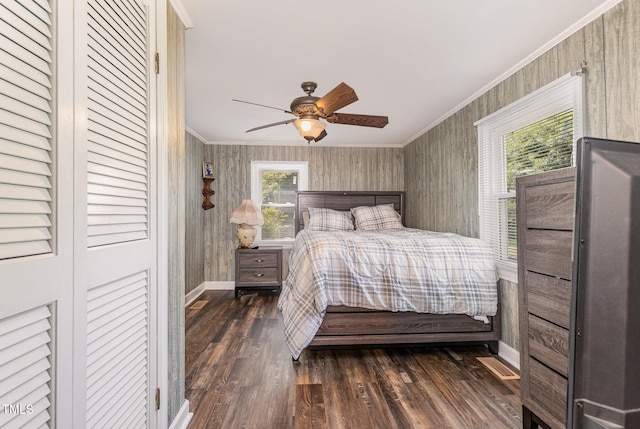1169 Clayhole Rd, Dunn, NC 28334 - bedroom featuring ornamental molding, dark wood-style floors, and a ceiling fan