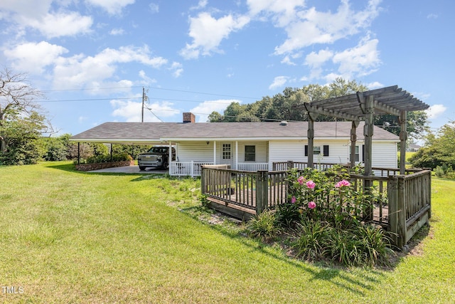 1169 Clayhole Rd, Dunn, NC 28334 - rear view of property with a yard, a deck, a pergola, and a chimney