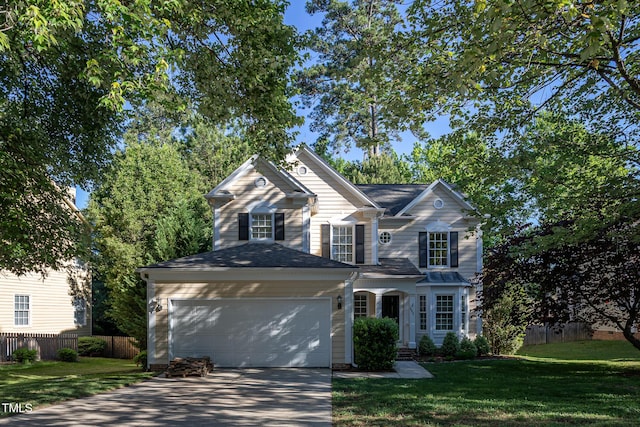 traditional-style house featuring an attached garage and concrete driveway