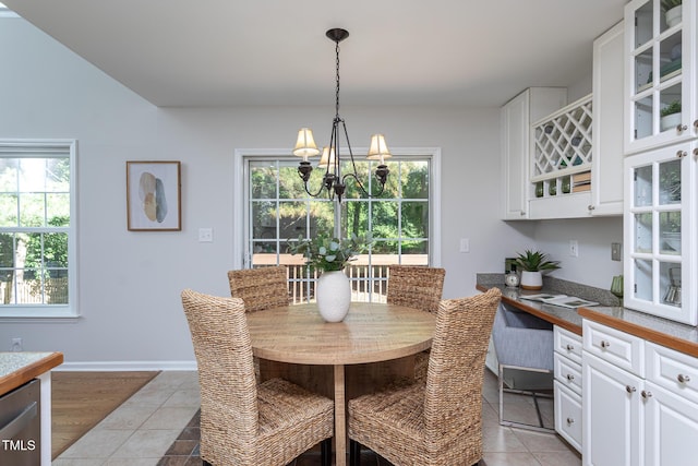 dining space featuring a chandelier