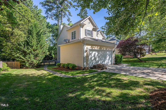 view of side of home with driveway and a chimney