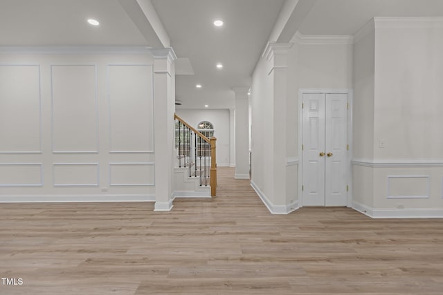 100 Citrus Pl, Cary, NC 27519 - hallway with ornate columns, light wood-type flooring, stairs, recessed lighting, and baseboards