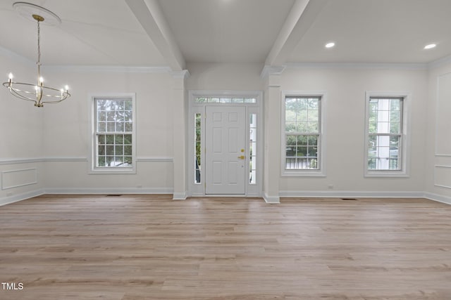 100 Citrus Pl, Cary, NC 27519 - foyer featuring a chandelier, light wood-style floors, crown molding, and recessed lighting