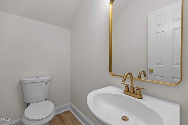 100 Citrus Pl, Cary, NC 27519 - half bath with a sink, wood finished floors, baseboards, and toilet