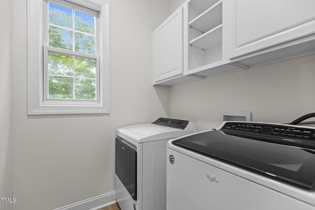 100 Citrus Pl, Cary, NC 27519 - clothes washing area with cabinet space, washing machine and clothes dryer, healthy amount of natural light, and baseboards