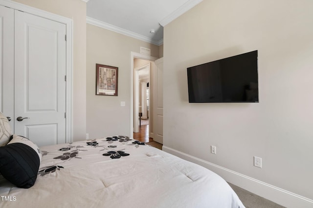 bedroom featuring ornamental molding and baseboards