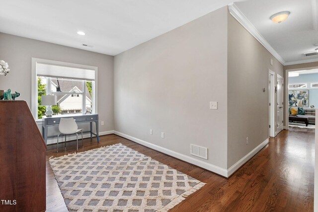office area featuring crown molding, baseboards, wood finished floors, and recessed lighting