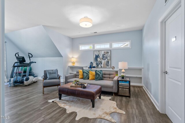 living area featuring wood finished floors and baseboards