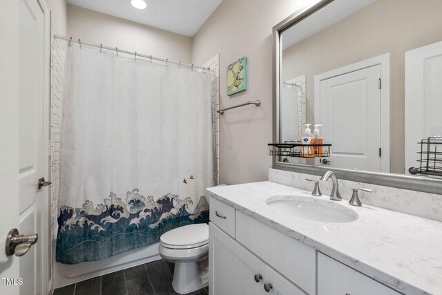 full bathroom with toilet, vanity, shower / bath combo, and recessed lighting