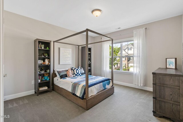 carpeted bedroom with baseboards