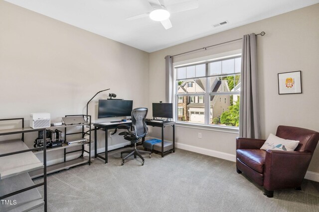 office space featuring carpet flooring, baseboards, and ceiling fan