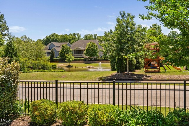 surrounding community featuring a water view