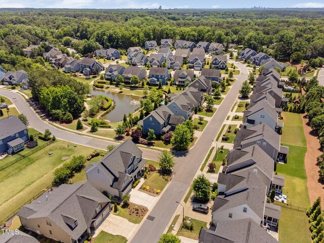 aerial view of residential area with a large body of water