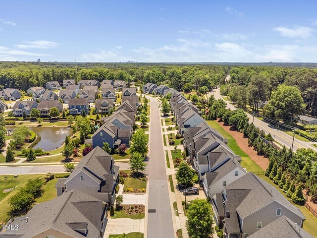 aerial view of residential area featuring a nearby body of water