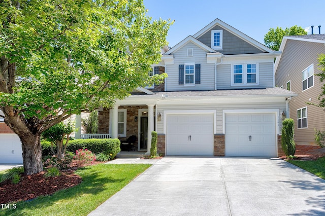 1141 Brookhill Way, Cary, NC 27519 - craftsman-style home with covered porch, concrete driveway, an attached garage, and stone siding