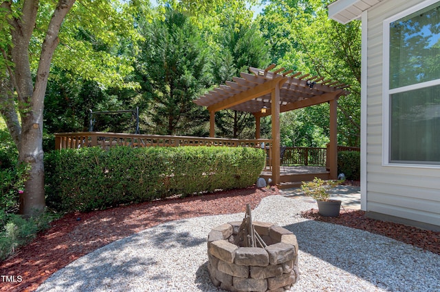 1141 Brookhill Way, Cary, NC 27519 - view of patio / terrace with a pergola, a fire pit, and a deck