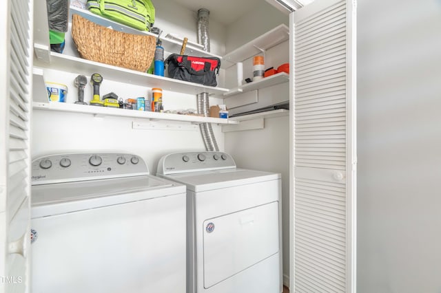 laundry room with washing machine and clothes dryer