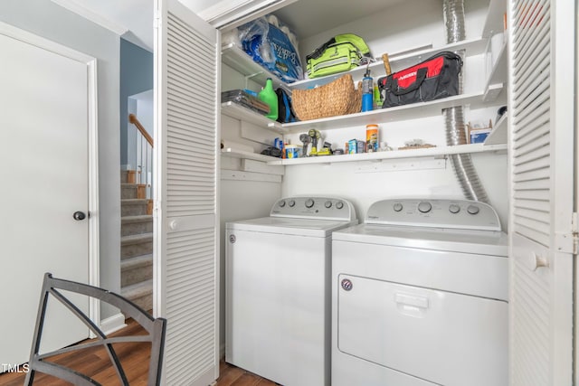 washroom with separate washer and dryer and wood finished floors