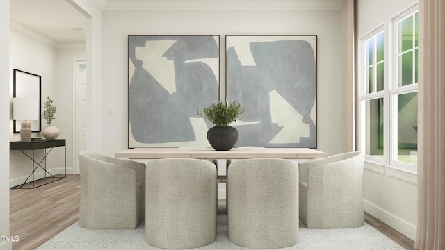 dining area with baseboards, ornamental molding, and wood finished floors