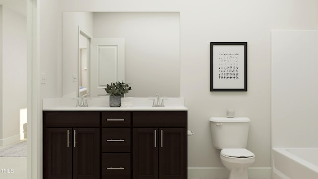 full bathroom featuring double vanity, toilet, a sink, a bathtub, and baseboards