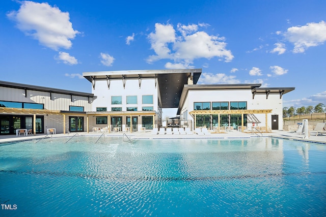 pool with fence and a patio