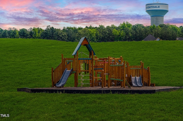 view of jungle gym featuring a lawn