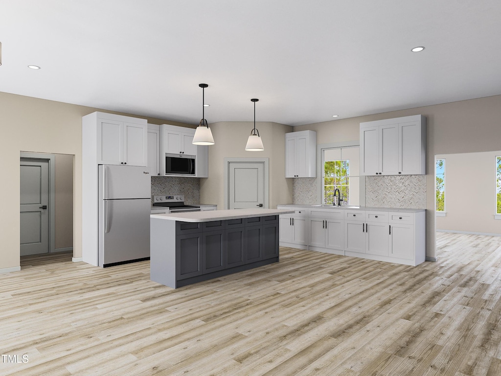 3188 Williams Ln, Graham, NC 27253 - kitchen featuring appliances with stainless steel finishes, tasteful backsplash, light wood-style flooring, light countertops, and recessed lighting
