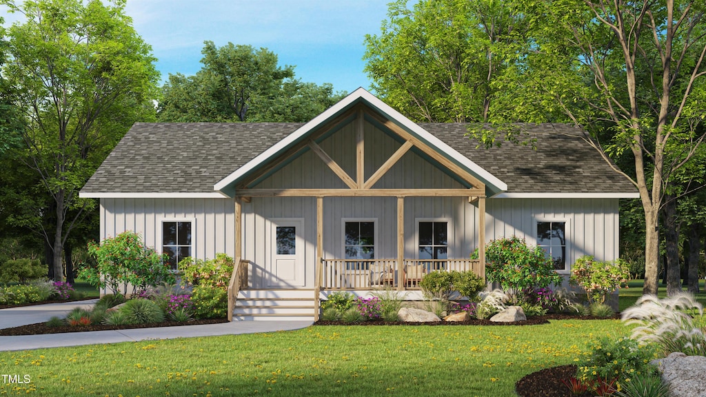 3188 Williams Ln, Graham, NC 27253 - modern farmhouse with a porch, roof with shingles, and a front lawn