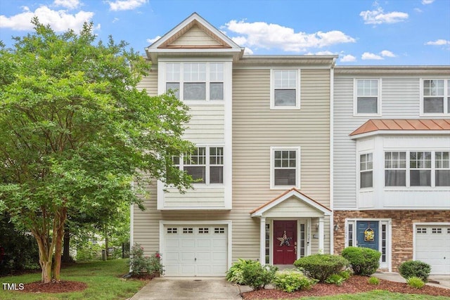 11925 Field Towne Ln, Raleigh, NC 27614 - view of property featuring a garage, concrete driveway, and stone siding